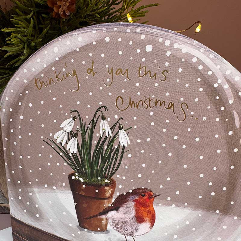Alex Clark Thinking Of You Snow Globe greeting card with a whimsical winter illustration and white envelope.
