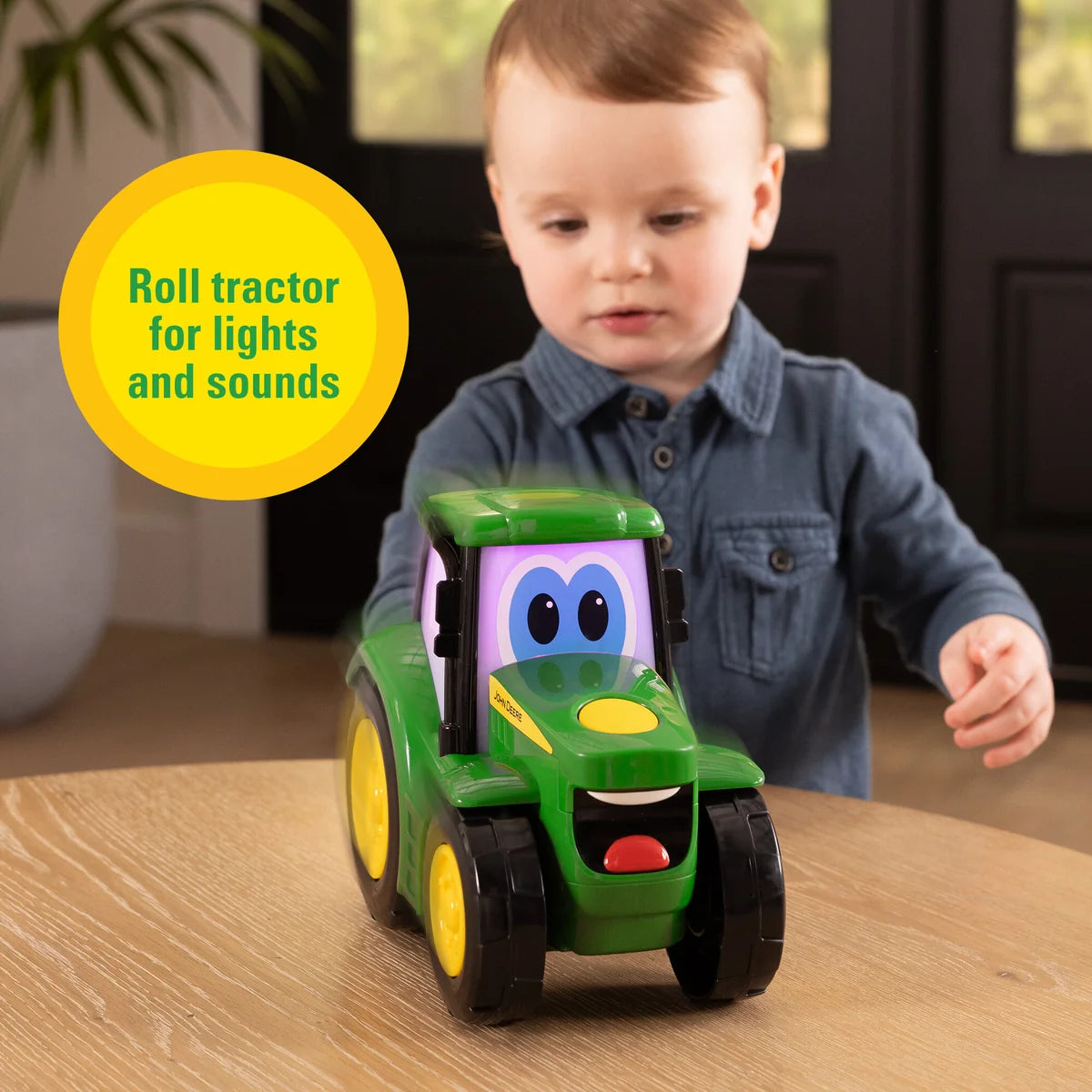 John Deere Lights & Sounds Johnny Tractor toddler toy showing cheerful eyes and green bonnet