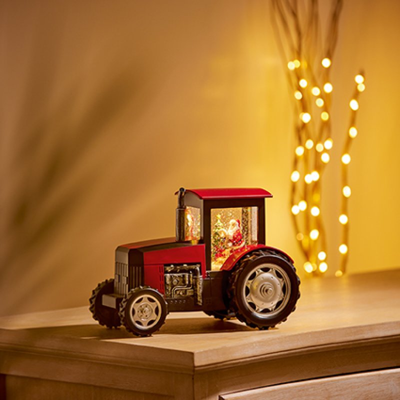 Premier 23cm battery operated lit musical water spinner tractor featuring Santa Claus inside with swirling glitter.