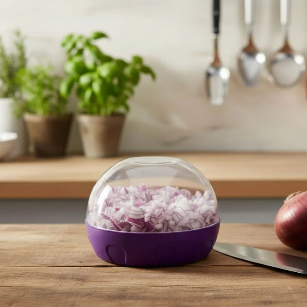 Progressive PrepWorks purple onion keeper container with clear dome lid filled with chopped red onions.