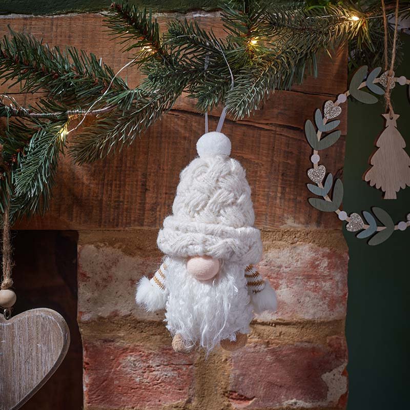 Smart Garden CosyGonk pendant hanging Christmas ornament with plush white beard and knitted hat hanging on a festive mantel garland.