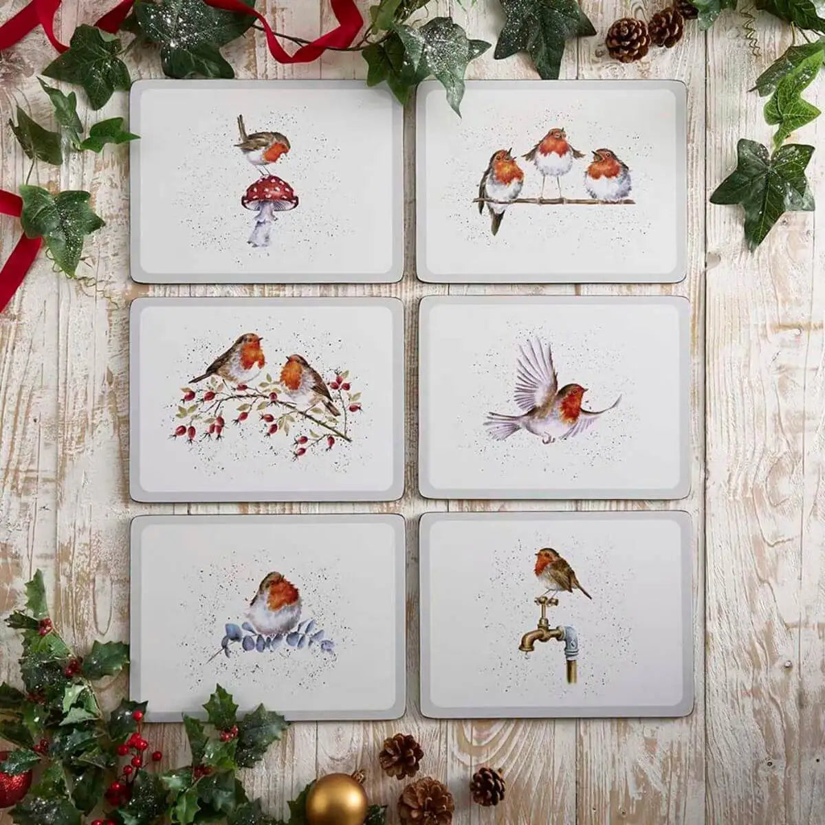 Wrendale Designs Festive Friends set of six cork-backed placemats featuring watercolour robin illustrations by Hannah Dale