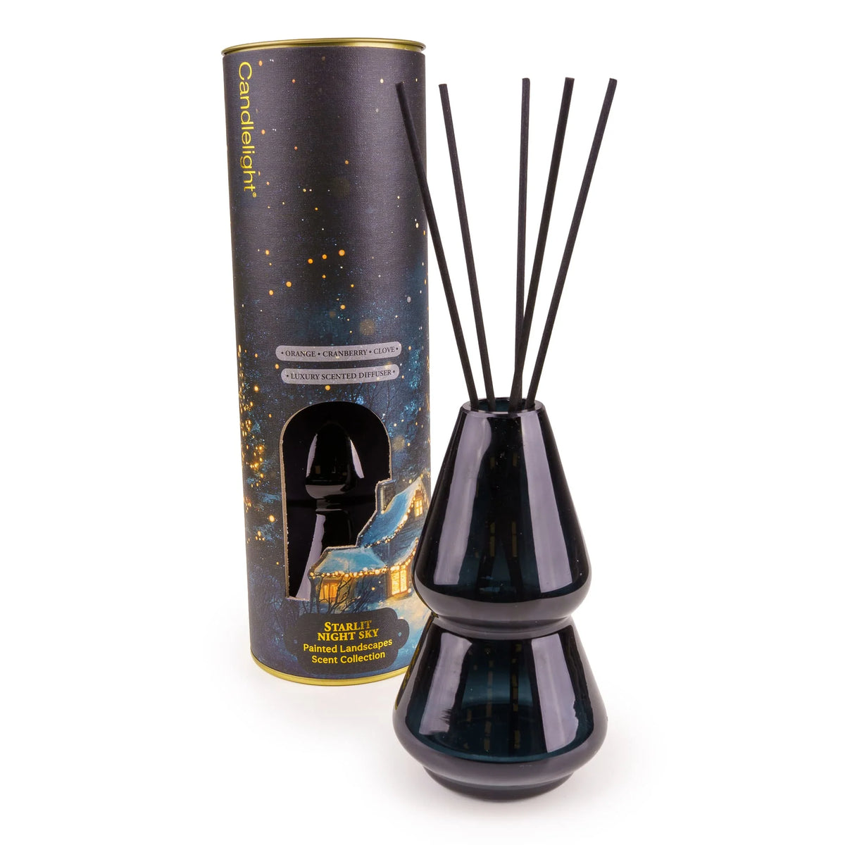 Candlelight Starlit Night Sky 150ml reed diffuser in deep midnight-blue glass bottle beside winter cottage gift tube