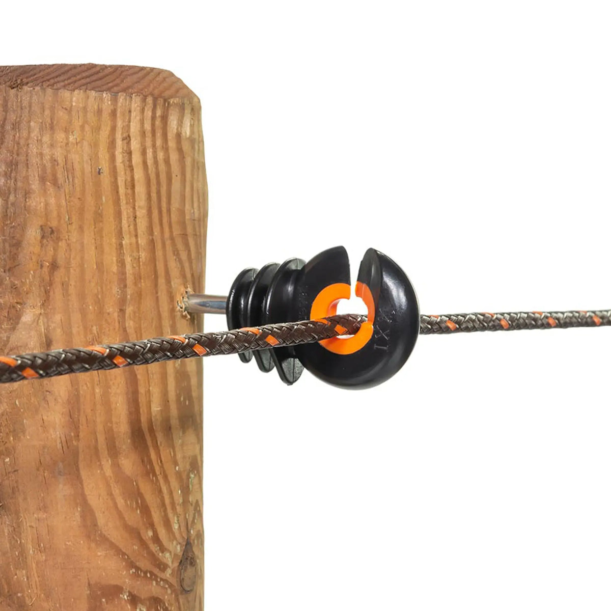 Gallagher XDI heavy-duty steel-core ring insulator mounted on a wooden electric fence post