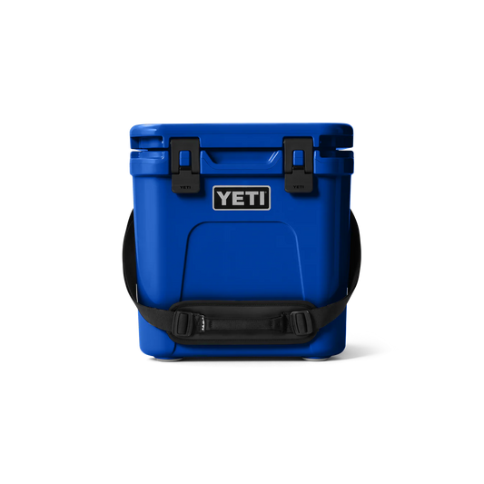 YETI Roadie 24 Cool Box in Royal Blue showing the robust upright design, haul strap, and secure latches.