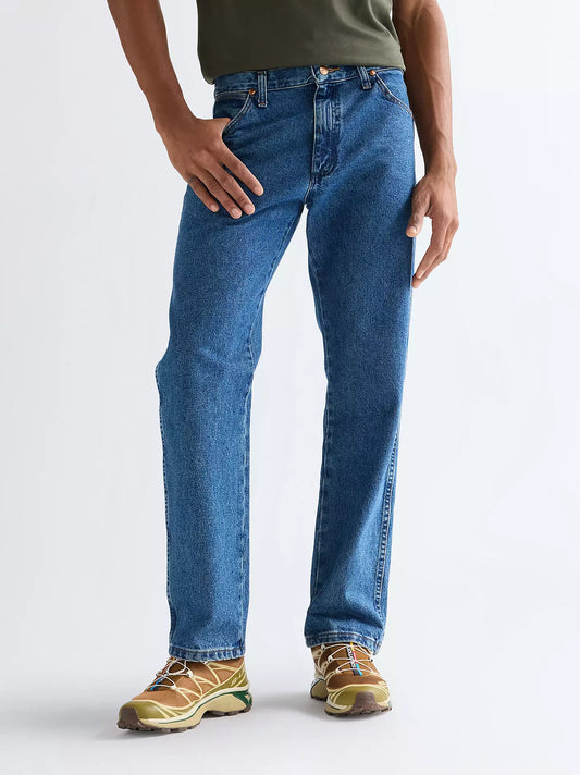 Wrangler 13MWZ Cowboy Cut Jeans in durable stonewash blue denim featuring classic five pocket design and W pocket stitching.
