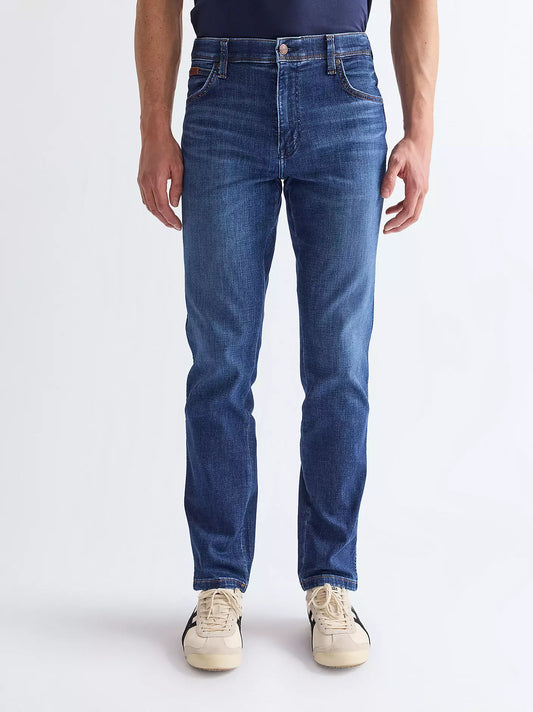 Wrangler Texas Slim High Stretch Jeans in Blue Jam blue featuring a slim leg, regular thigh, and classic leather logo patch.