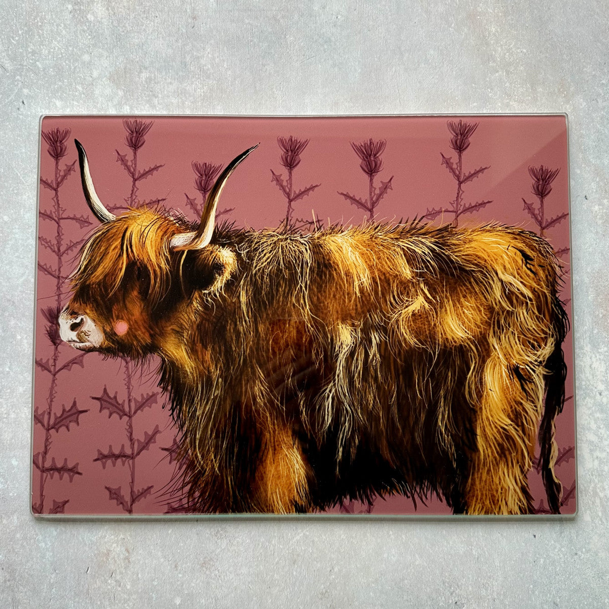 Alex Clark Highland Cow glass worktop saver featuring a countryside cow illustration