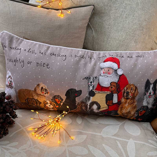 Alex Clark Naughty Or Nice Christmas cushion featuring festive animal illustrations