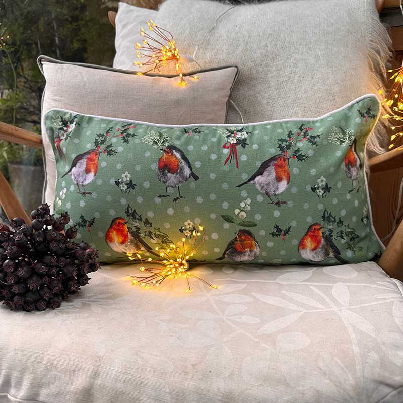 Alex Clark Robin & Holly Christmas cushion featuring festive robin and holly branch illustrations
