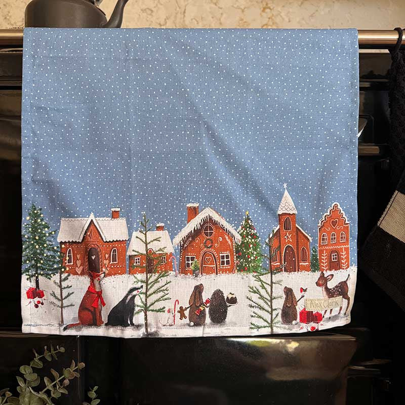 Alex Clark Gingerbread Village Christmas cotton tea towel featuring festive gingerbread house illustrations