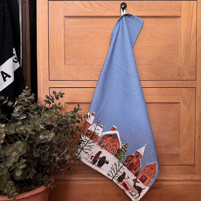 Alex Clark Gingerbread Village Christmas cotton tea towel featuring festive gingerbread house illustrations