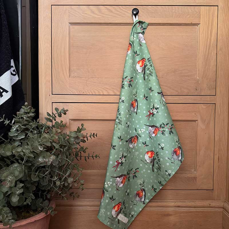 Alex Clark Highland Cows Christmas cotton tea towel featuring festive countryside cow illustrations
