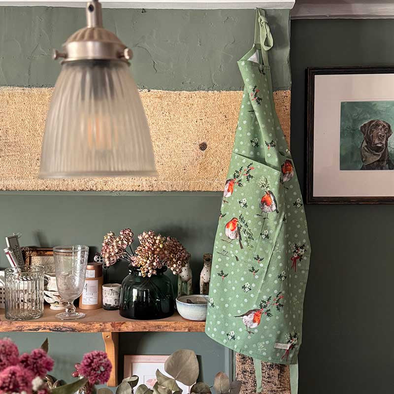 Alex Clark Robins & Holly Christmas cotton apron featuring festive robin and holly illustrations