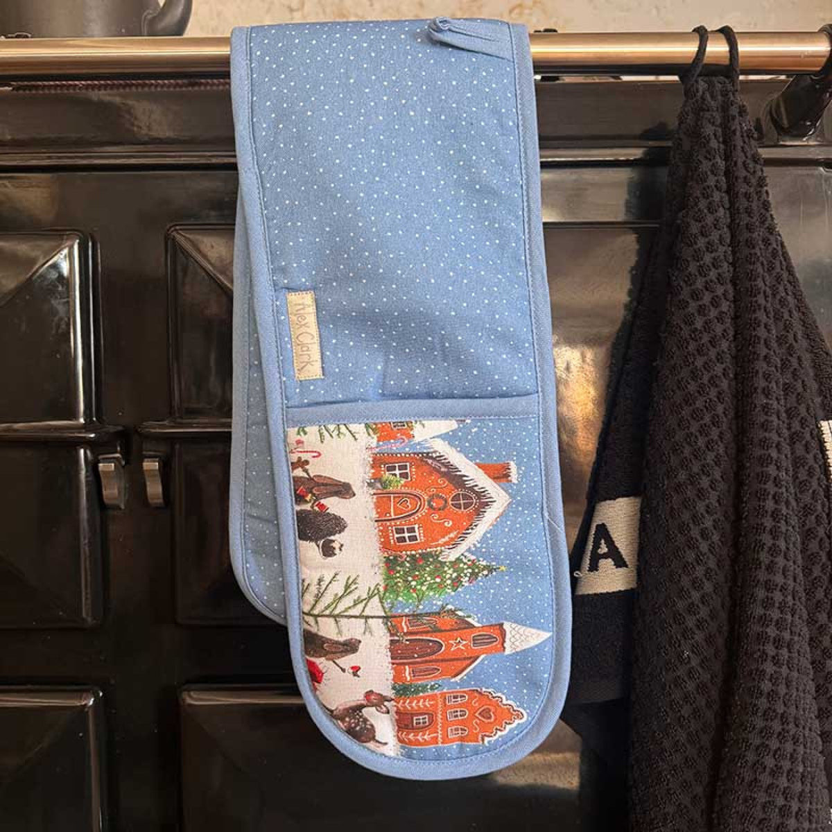 Alex Clark Gingerbread Village Christmas double oven gloves featuring festive gingerbread house illustrations