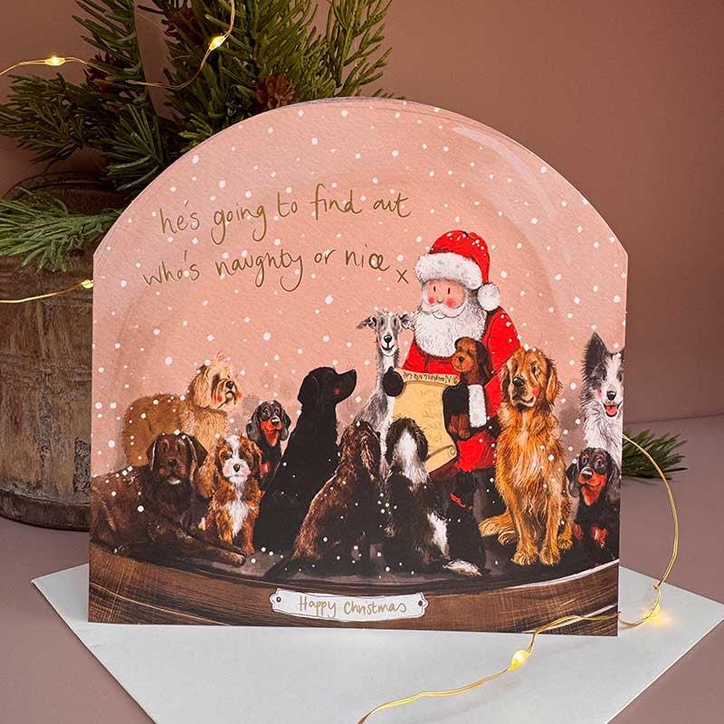 Alex Clark Naughty or Nice Snow Globe greeting card depicting a festive illustration with a white envelope.