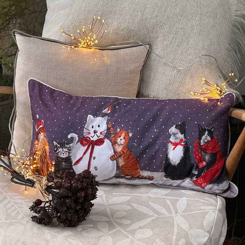 Alex Clark Cats & Snowman Christmas cushion featuring festive cat and snowman illustrations