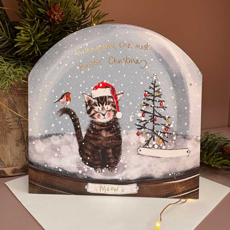 Alex Clark Perrfect Christmas Snow Globe greeting card depicting a cozy cat inside a snowy globe with a white envelope.