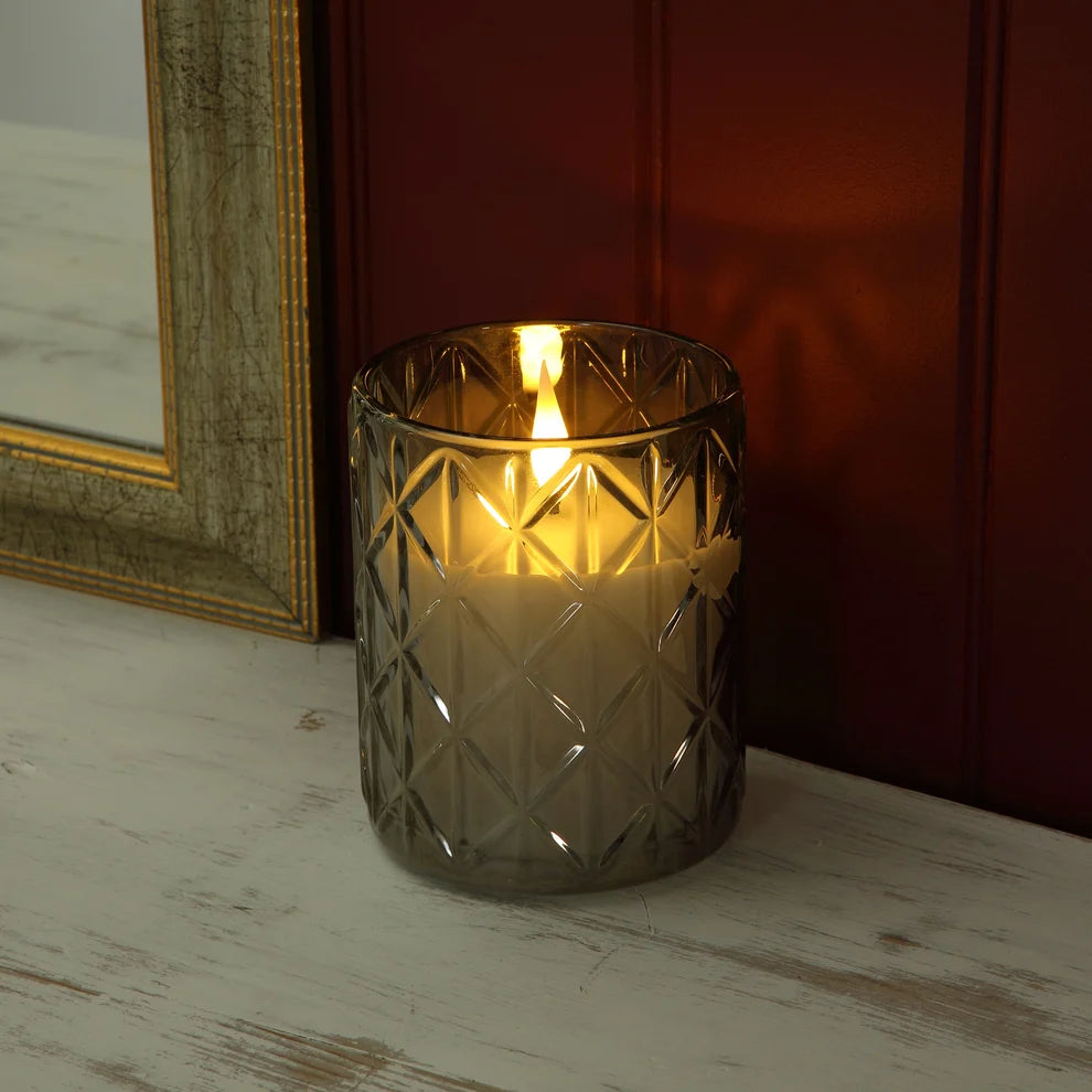 Noma 12cm faceted crystal glass battery operated LED candle displaying a flickering warm flame effect