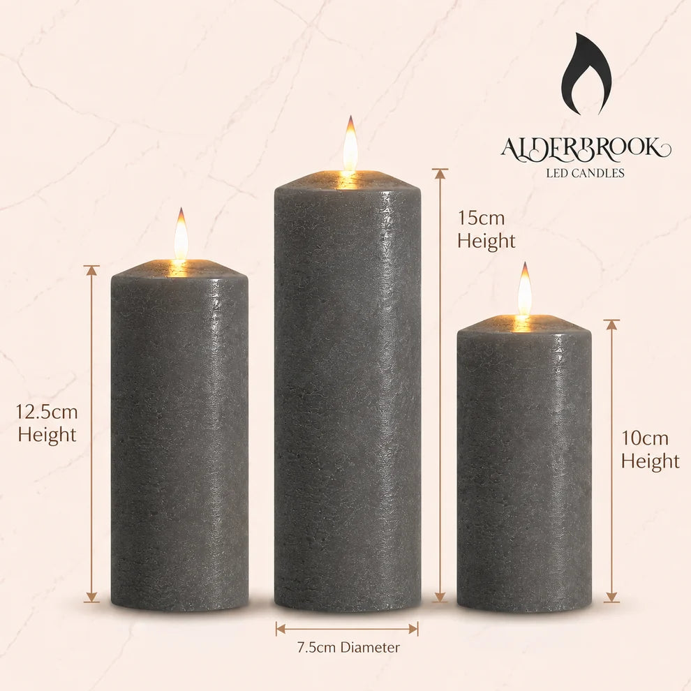 Noma set of 3 pewter flameless LED pillar candles displaying a warm flickering flame effect