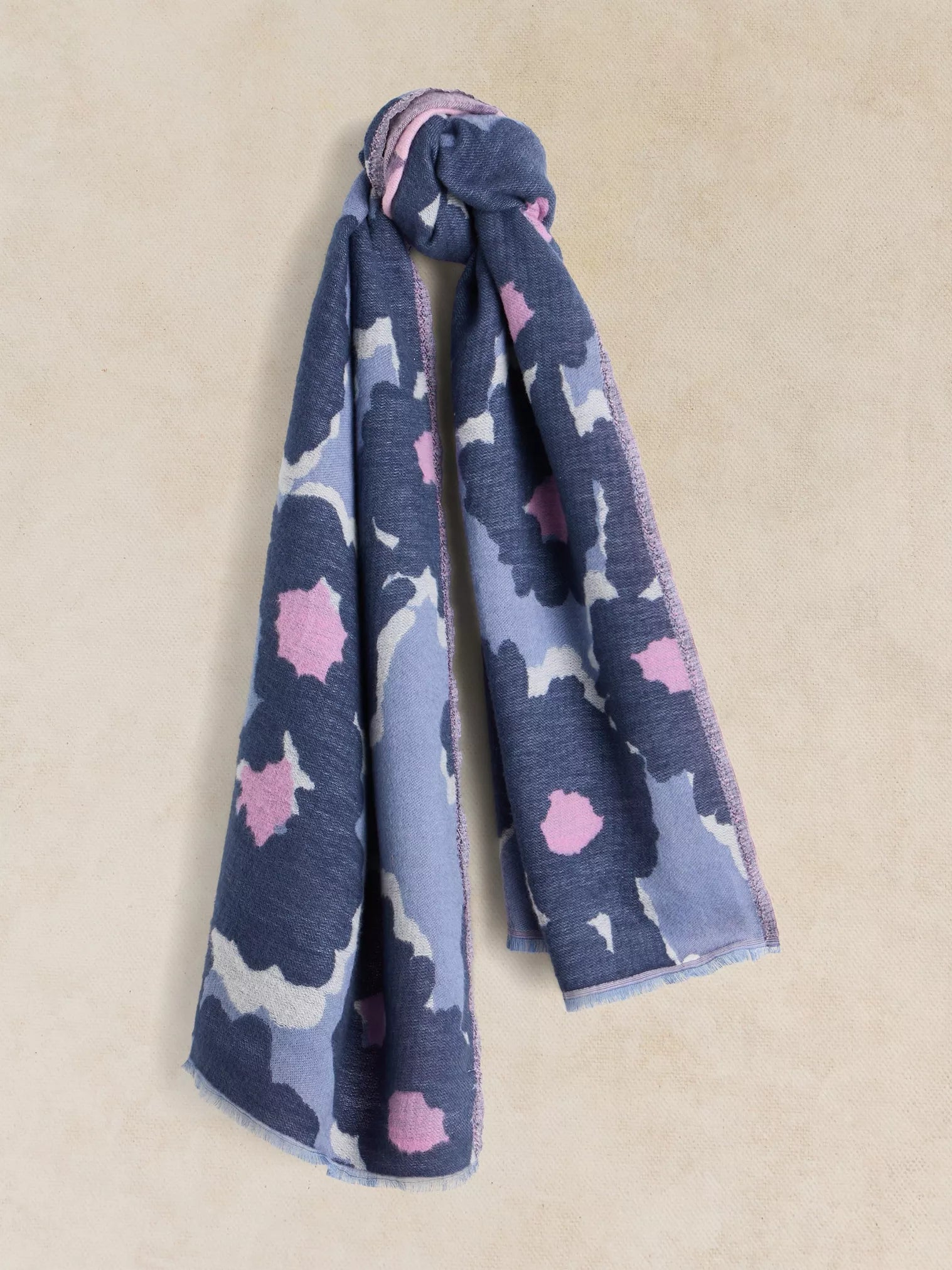 White Stuff Selma midweight scarf in a soft painterly print, draped elegantly to show its generous rectangular dimensions.