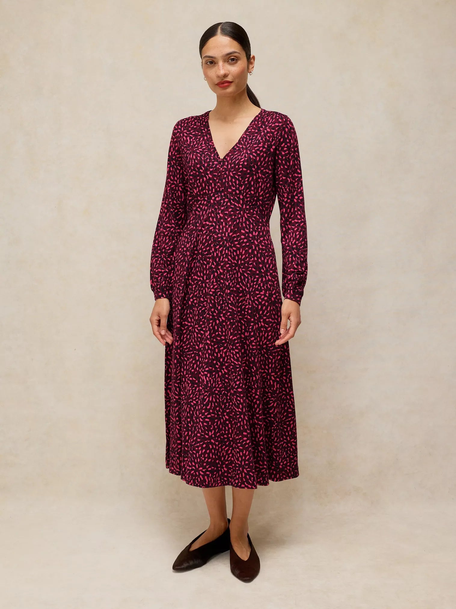 Women's White Stuff Megan long-sleeve midi dress featuring a classic fit, V-neckline, and fluid jersey drape.