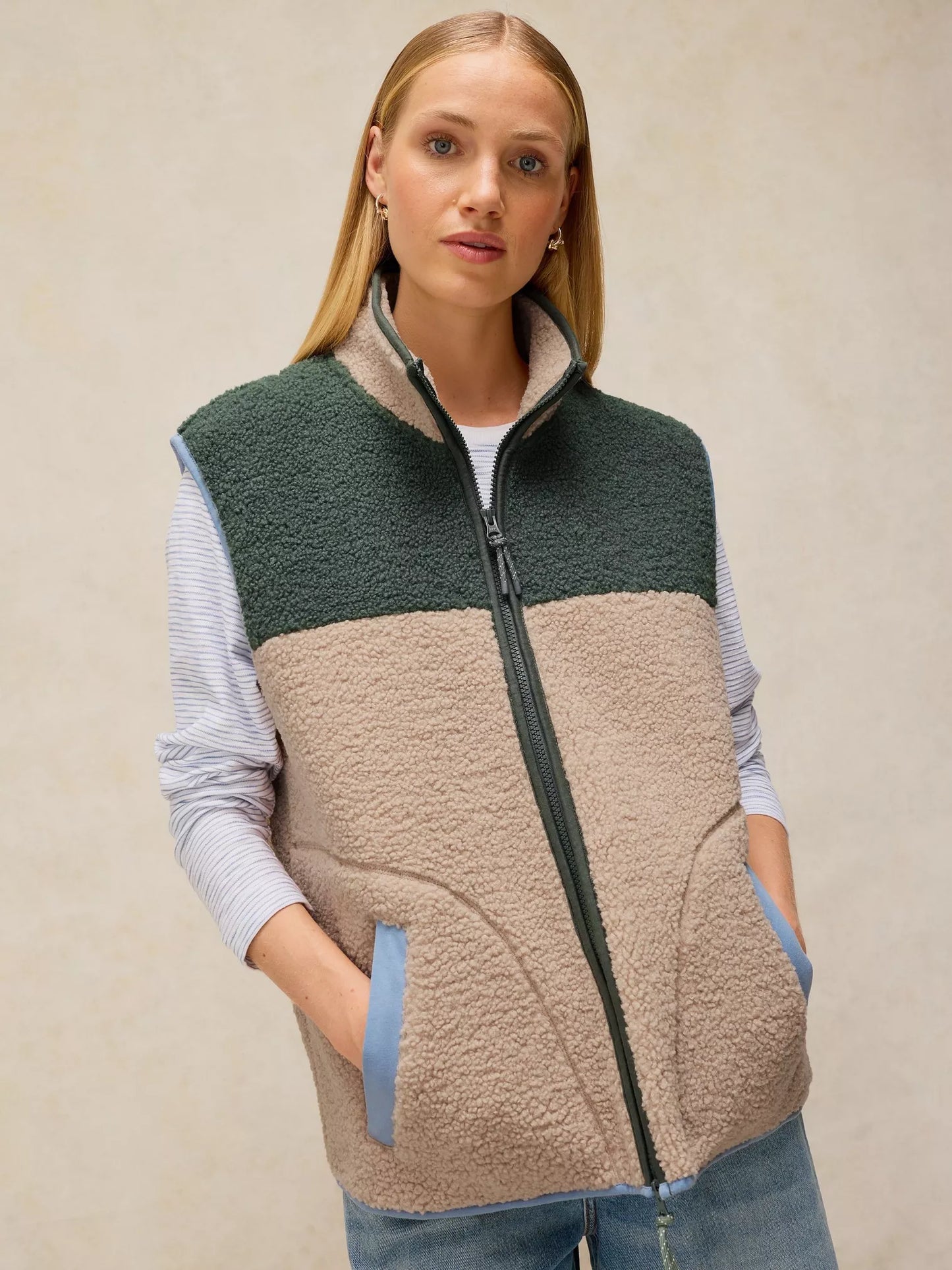 White Stuff Borg Gilet featuring a high neck and sleeveless design, ideal for practical outdoor layering.