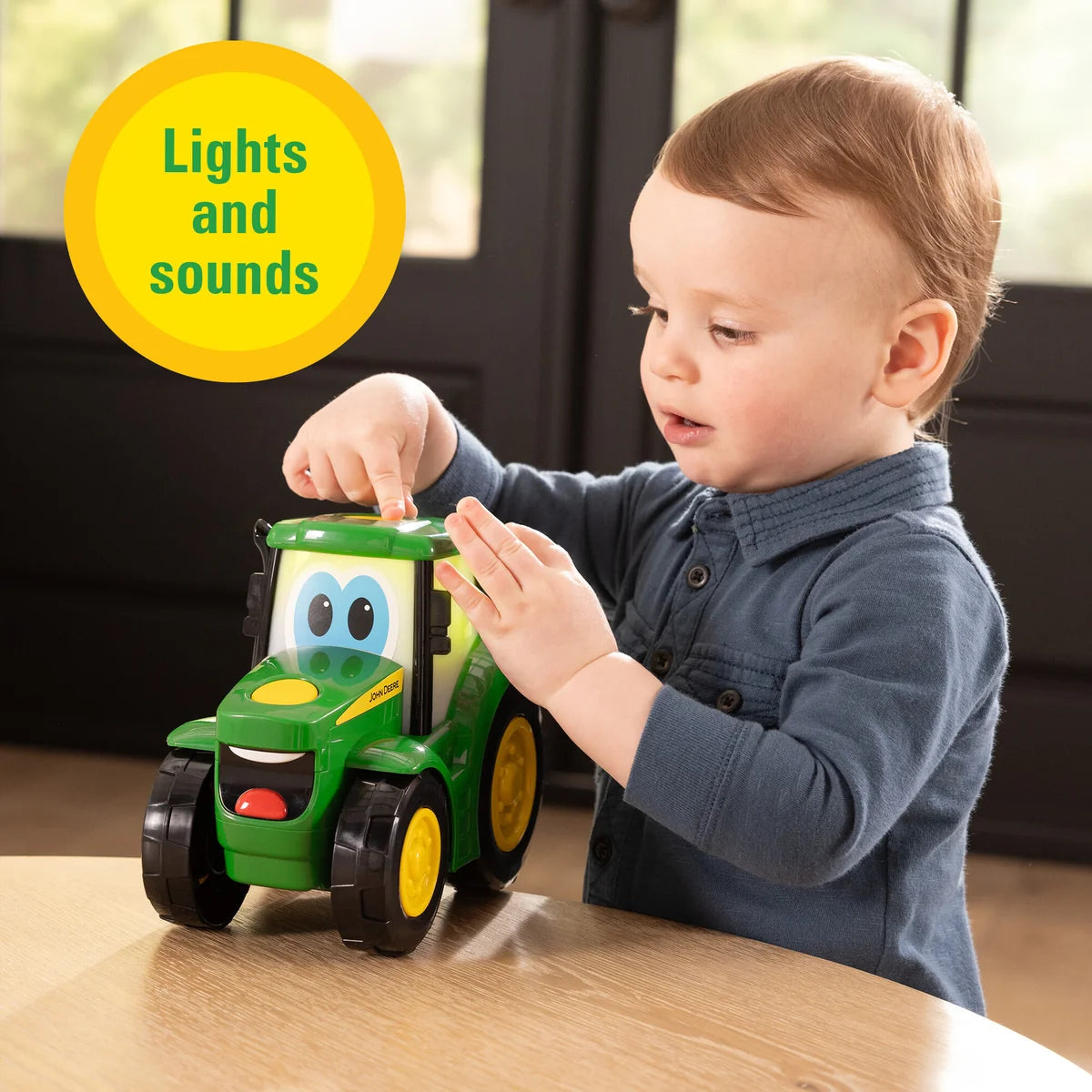 John Deere Lights & Sounds Johnny Tractor toddler toy showing cheerful eyes and green bonnet