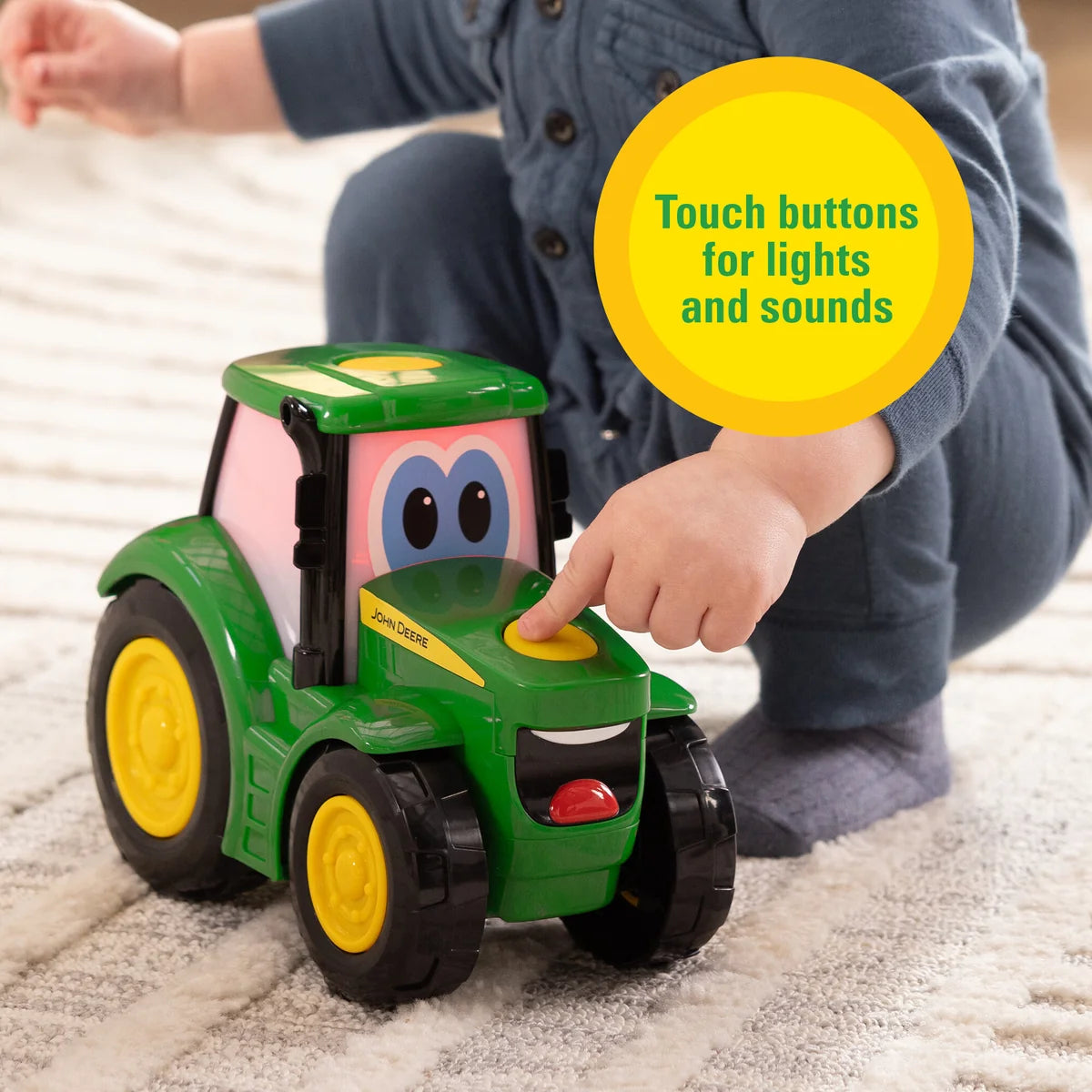 John Deere Lights & Sounds Johnny Tractor toddler toy showing cheerful eyes and green bonnet