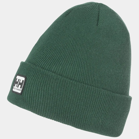 Close-up of the Helly Hansen Urban Cuff Beanie featuring a thick ribbed knit construction, a folded cuff, and the classic HH heritage logo patch.