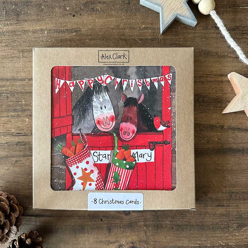 Alex Clark Christmas Stable boxed greeting card set showing illustrated festive farm animal cards and white envelopes in a box.