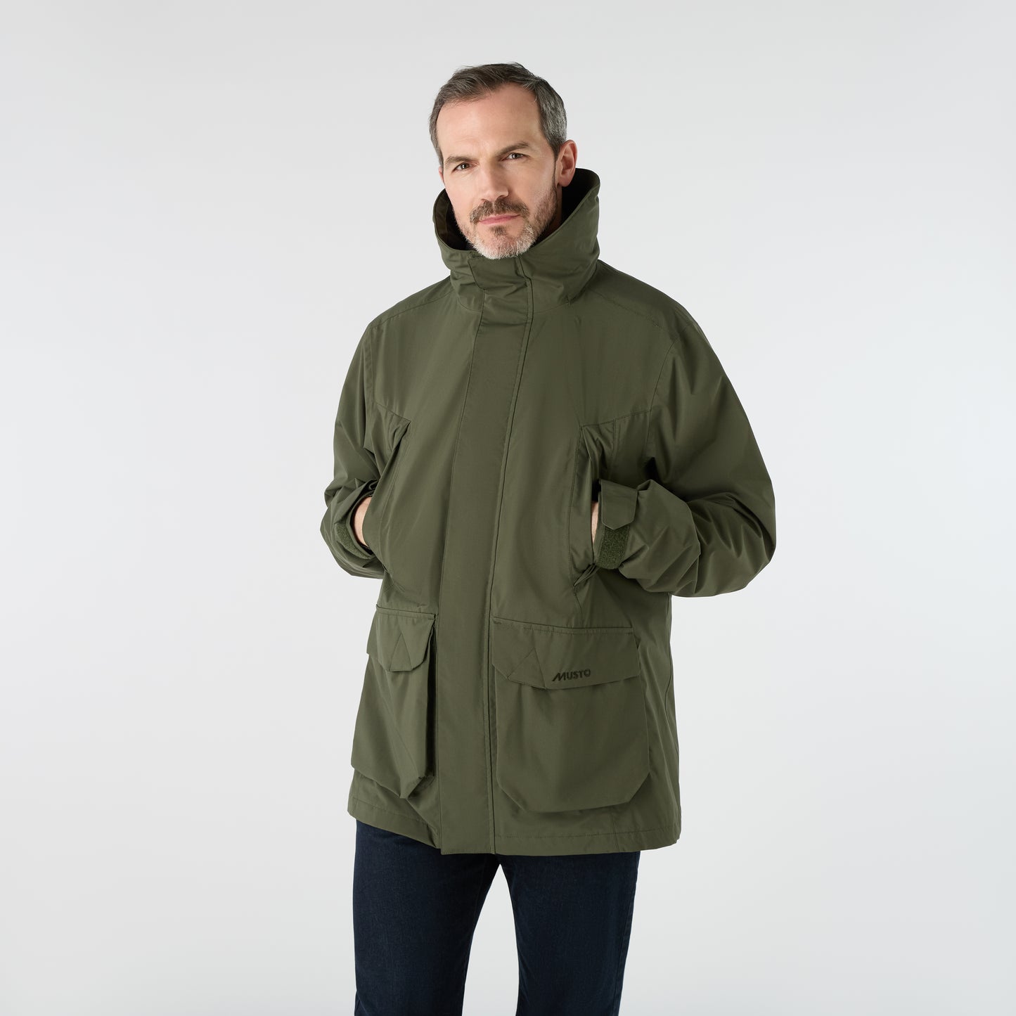 Musto Men's Fenland Jacket 3.0 in Deep Green, featuring a waterproof outer, practical pockets, and a classic zip front with storm flap.