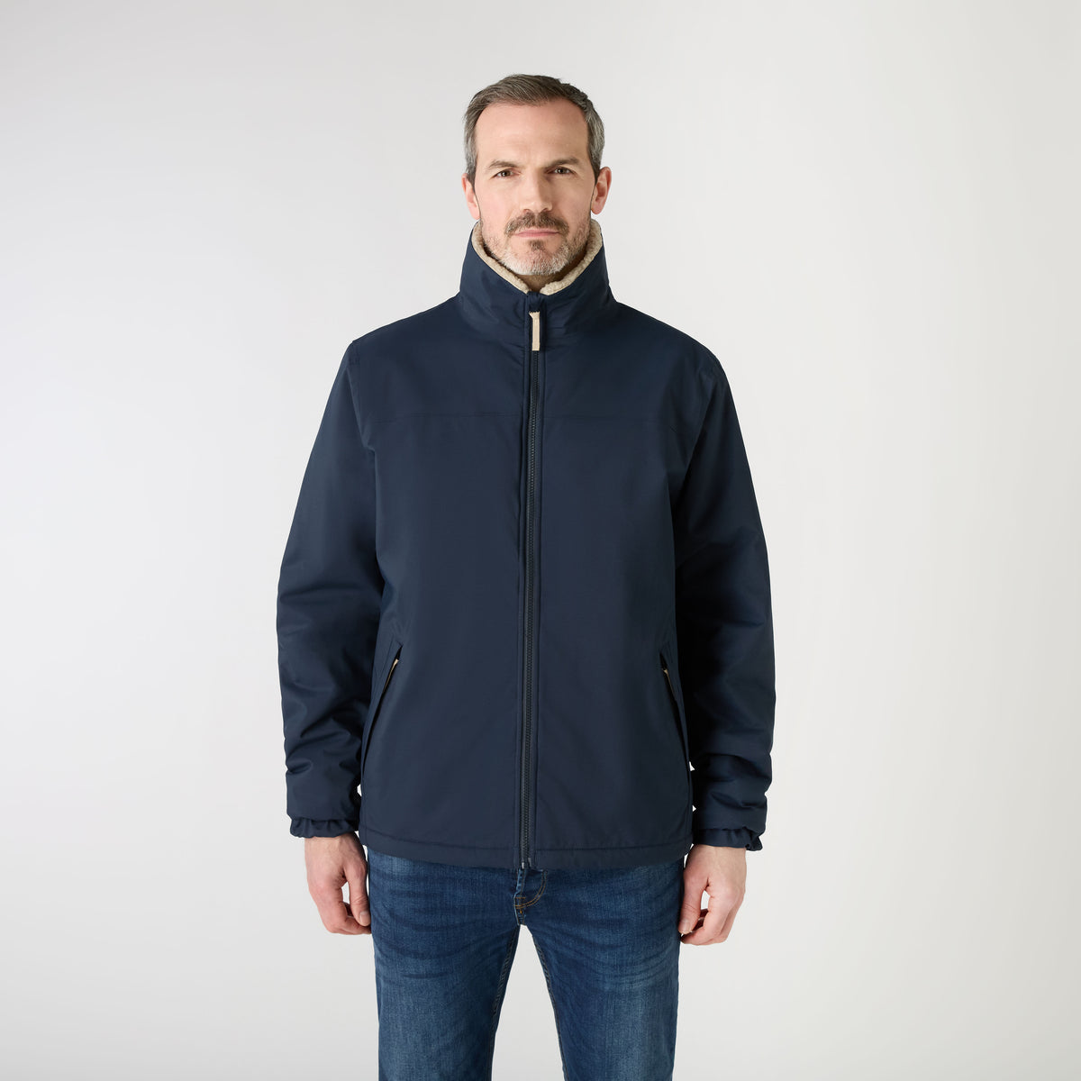 Musto Men's Snug Reversible Pile Jacket in soft fleece featuring full zip closure and chest pocket.