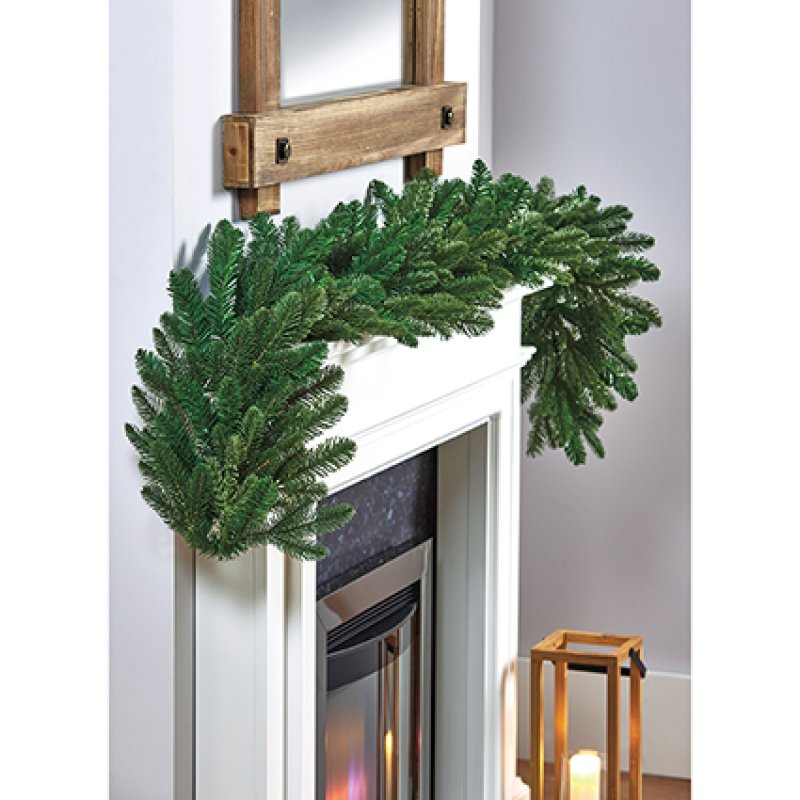 Premier 1.8-metre PE Nordmann Fir realistic artificial Christmas garland displayed on a mantelpiece
