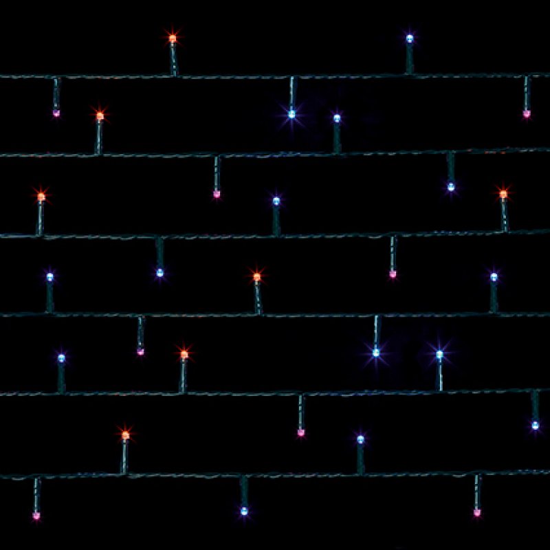 Premier 120 Multi Action Rainbow LED Supabrights with Timer woven around a small Christmas tree