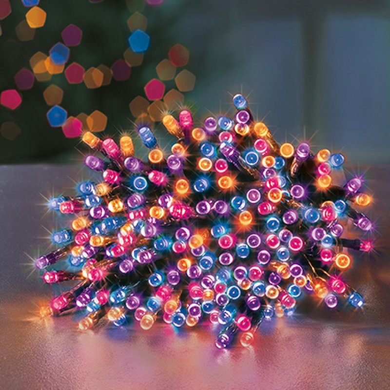 Premier 120 Multi Action Rainbow LED Supabrights with Timer woven around a small Christmas tree
