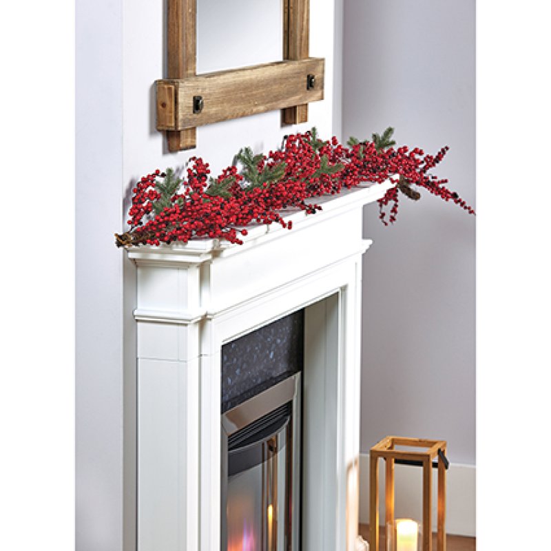 Premier 1.8m Red Berry Garland draped across a wooden fireplace mantel