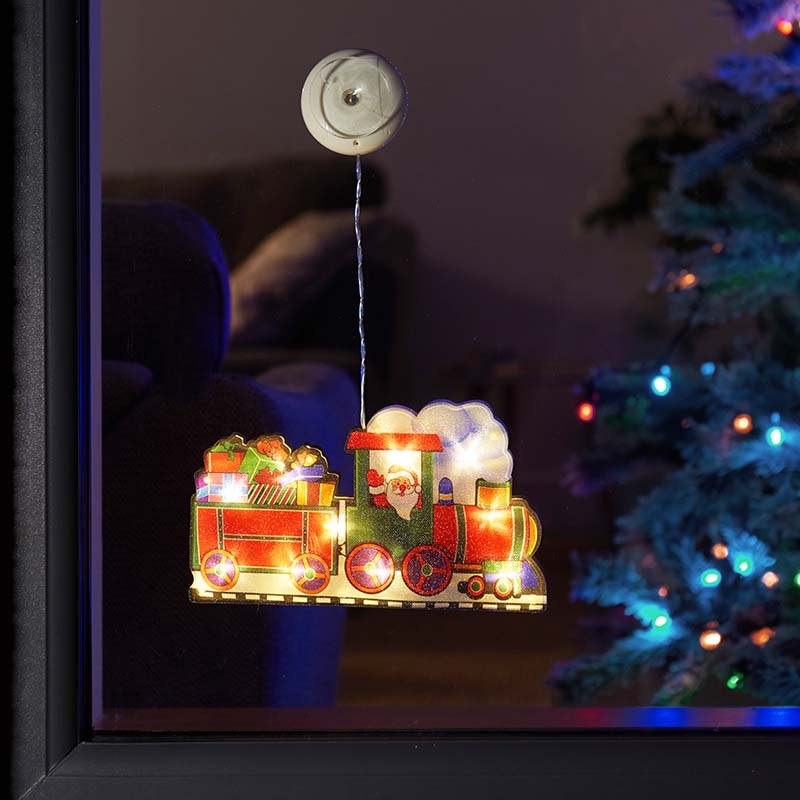 Smart Garden Vintage Window Train Christmas Decoration arranged on a festive windowsill