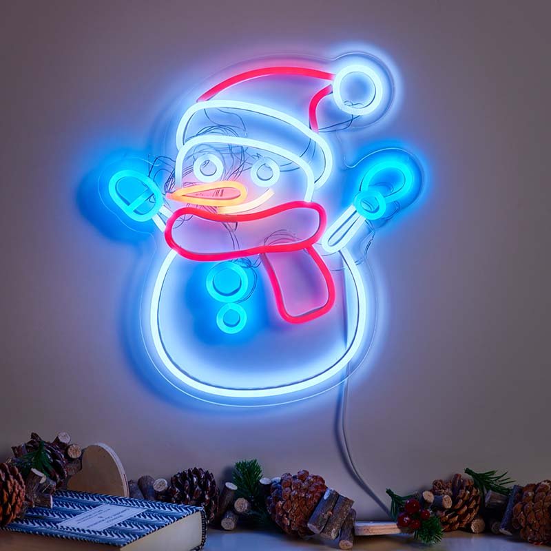 Smart Garden NeonEsque Frosty LED snowman light illuminated on an indoor wall