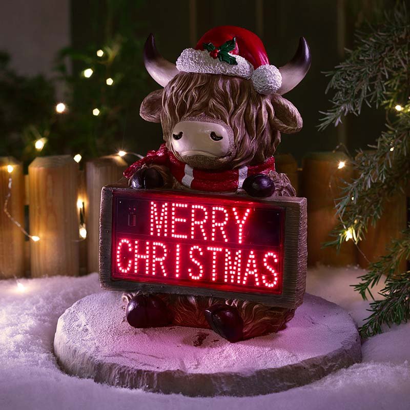 Smart Garden Highland Cow Merry Christmas decoration displayed indoors