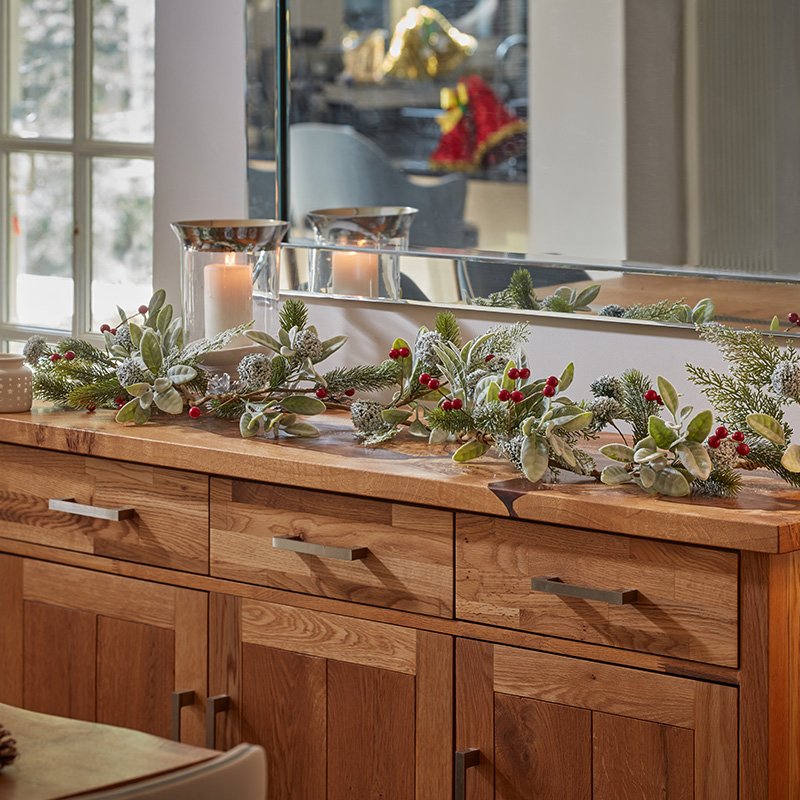 Smart Garden FrostBerry Garland 180cm with frosted berries and pine foliage draped across a fireplace mantel