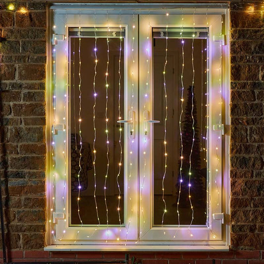 Smart Garden TwoTone Curtain Net Lights 200 LED in warm white and multicolour mode displayed on a window