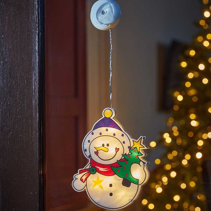 Smart Garden Vintage Window Frosty decoration glowing with warm LED light in a window.