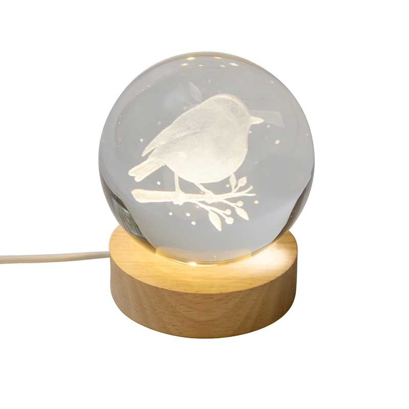 Smart Garden InLit GloBall Robin indoor light display illuminated on a mantelpiece