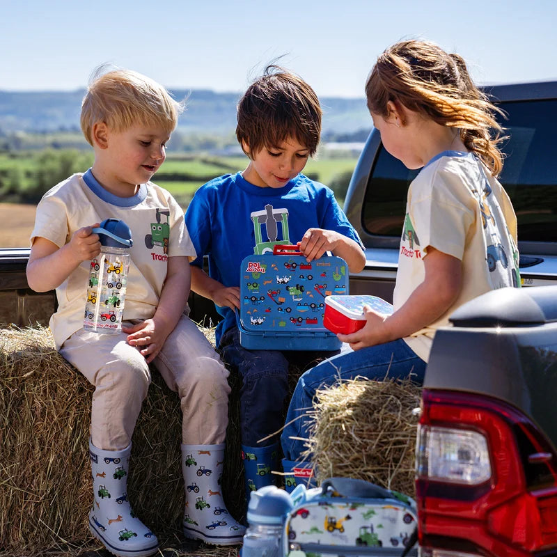 Tractor Ted Farmyard Lunch Box featuring green farm machinery graphics on the front lid<