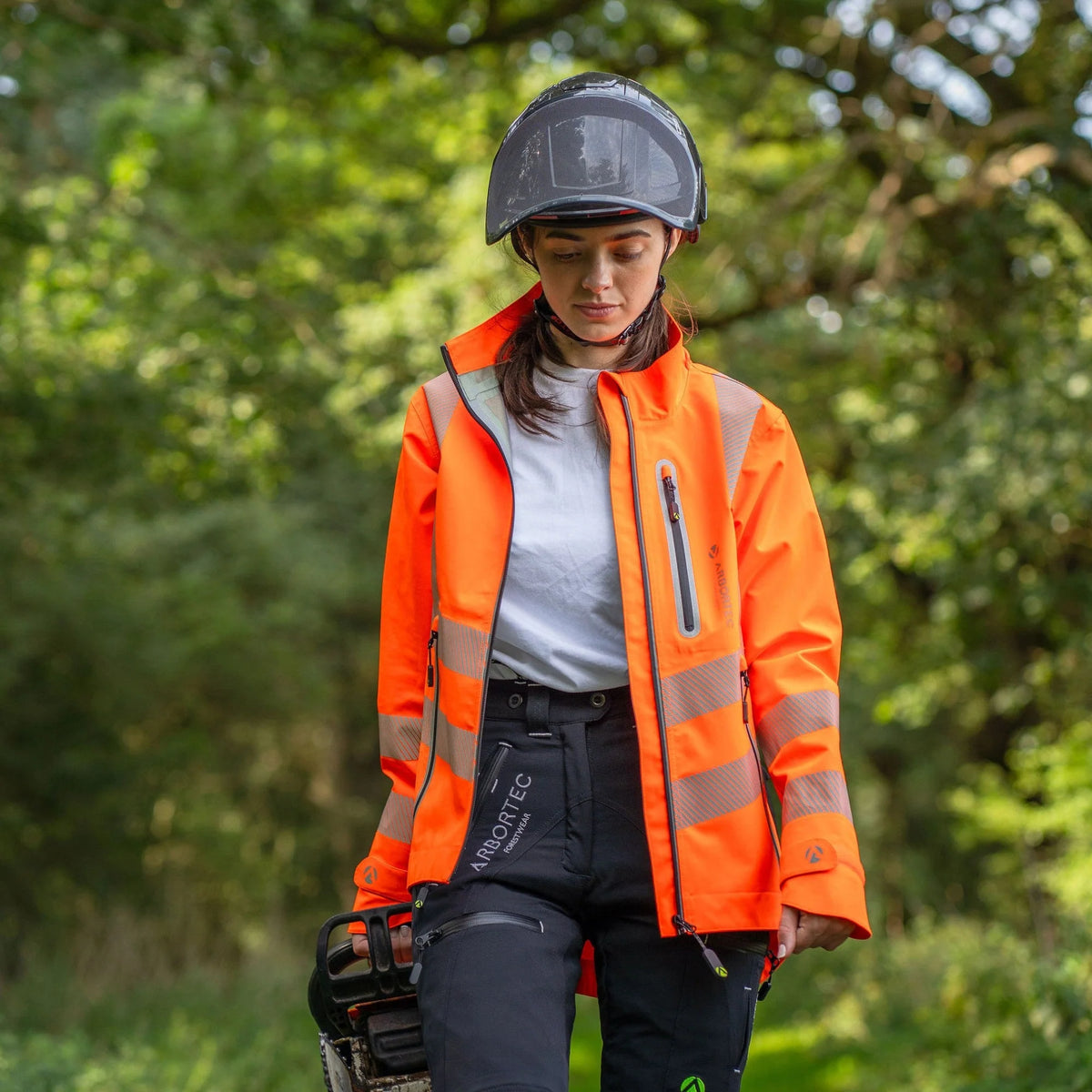 Arbortec ATHV4420 BreatheDry women's high-visibility orange waterproof railway and arborist work jacket with reflective tape detailing