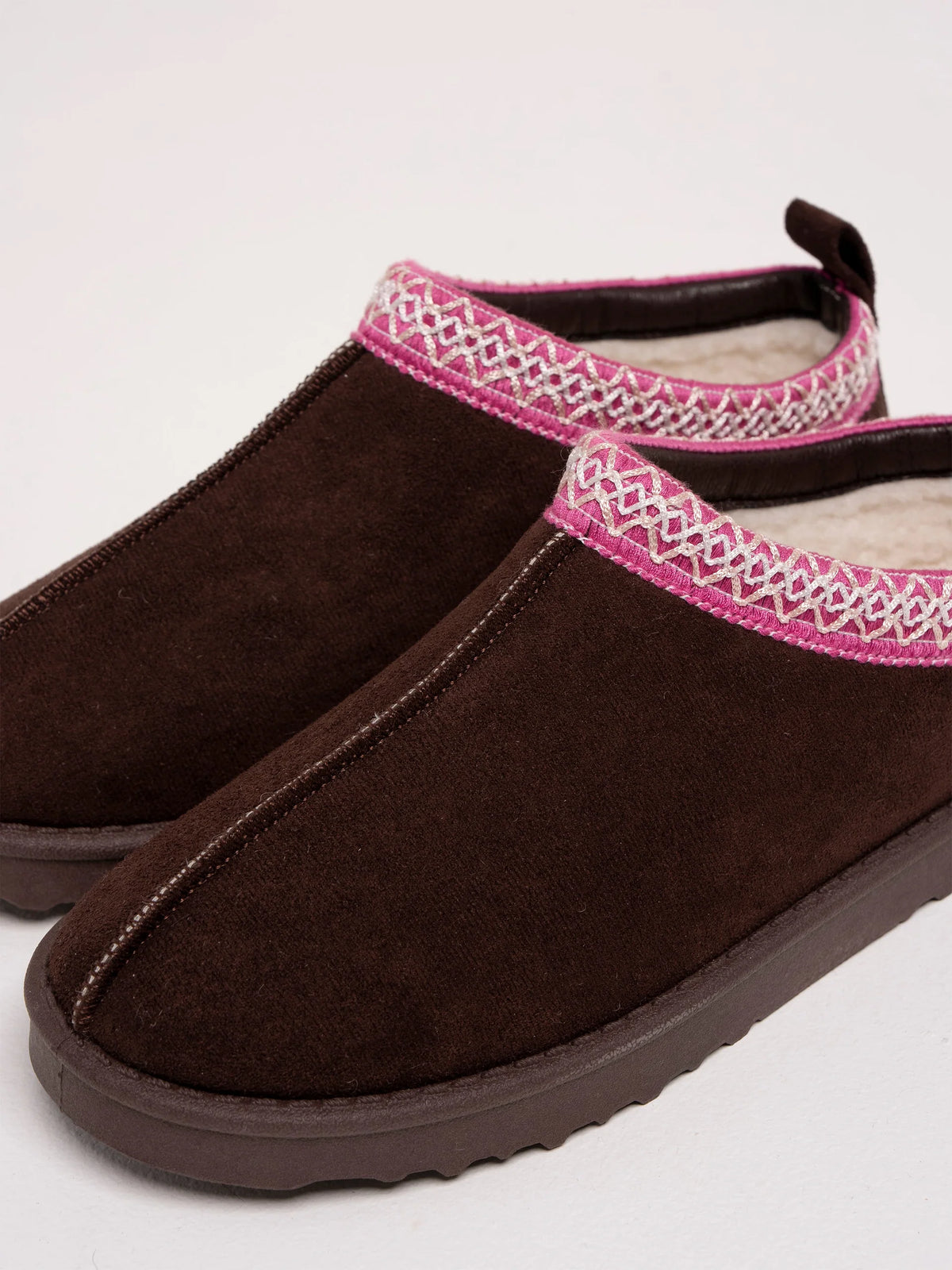 Brakeburn Frosty Morning Slipper in chocolate brown faux suede featuring pink ribbon trim and faux shearling lining