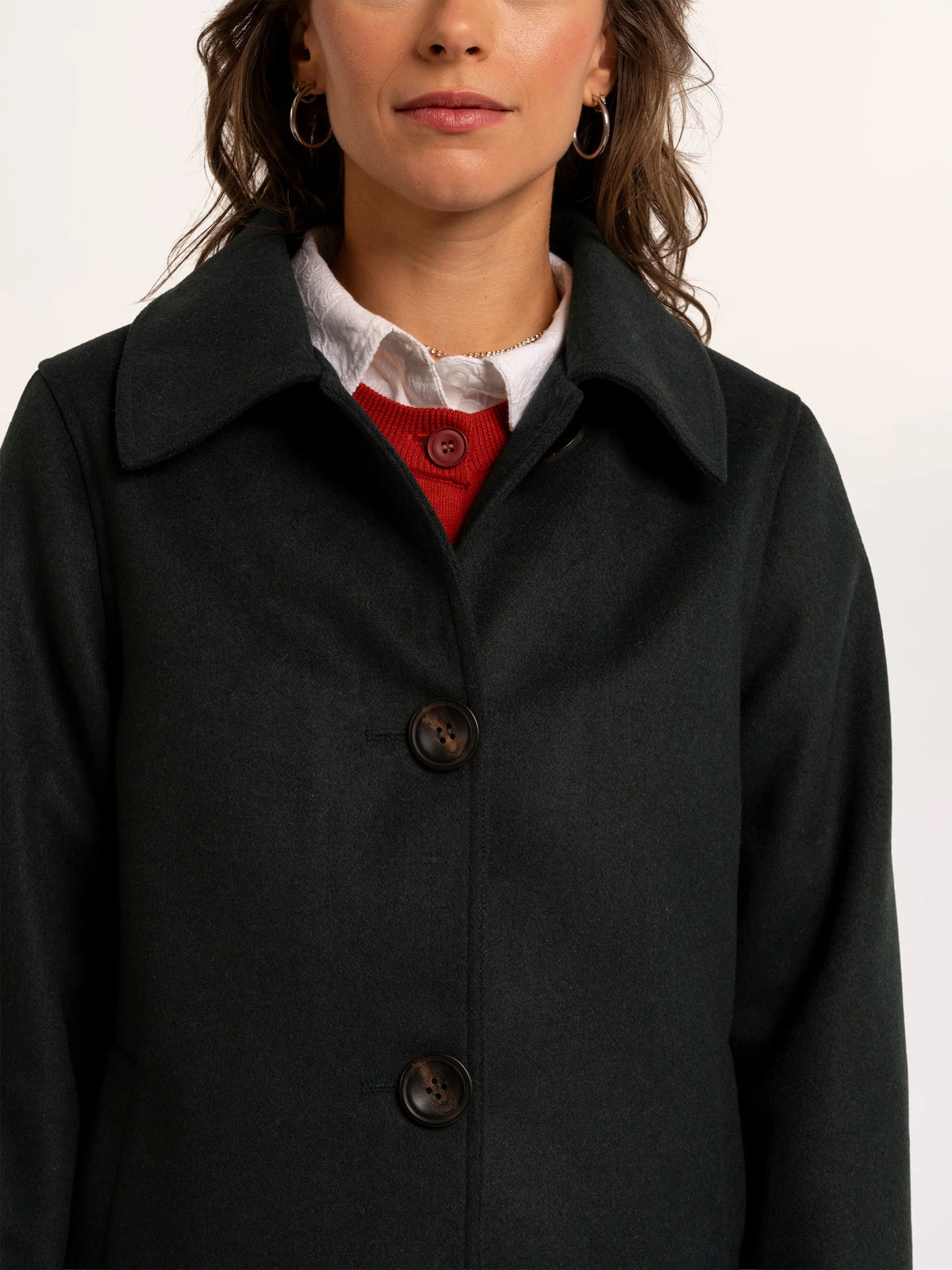 Brakeburn Hazel Teal Collared Jacket in deep teal styled over a white cable knit jumper
