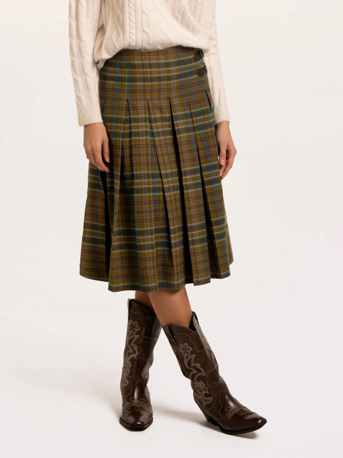 Brakeburn Red Cedar Check Pleated Kilt Skirt styled with a cream cable knit jumper and brown boots