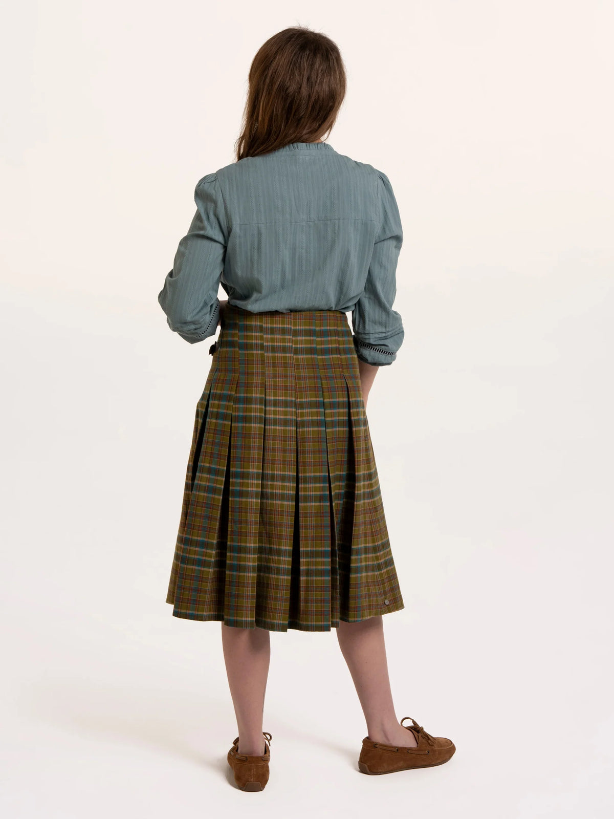 Brakeburn Red Cedar Check Pleated Kilt Skirt styled with a cream cable knit jumper and brown boots